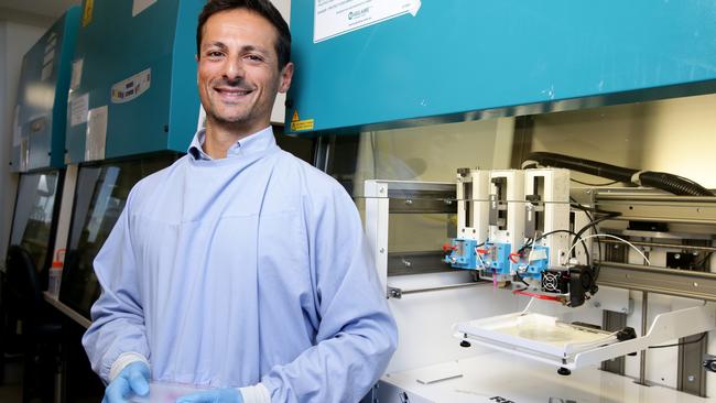 Dr Carmine Gentile with the 3D bioprinter he uses to make the mini-hearts. Picture: Jonathan Ng