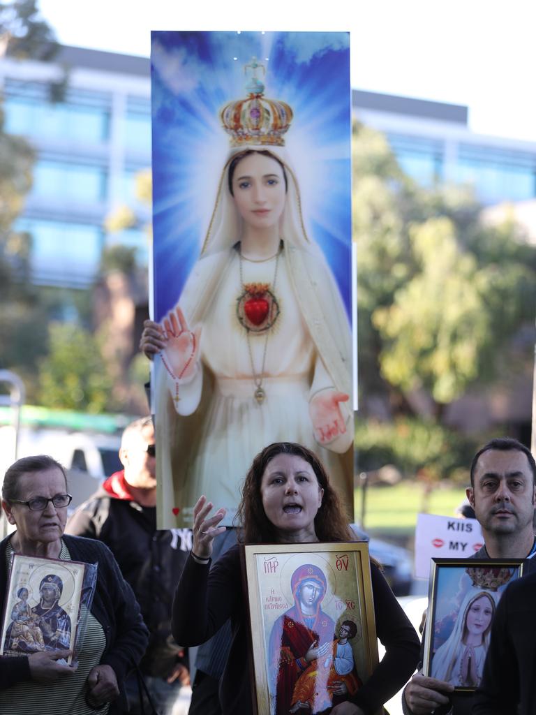 Protesters outside the KIIS FM studio at North Ryde . Protesters are holding a peaceful stand outside the studios while Kyle and Jackie o are on holidays .picture John Grainger