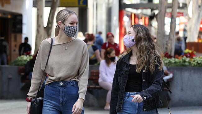 People wearing masks in the Queen Street Mall, Brisbane. Pics Tara Croser.