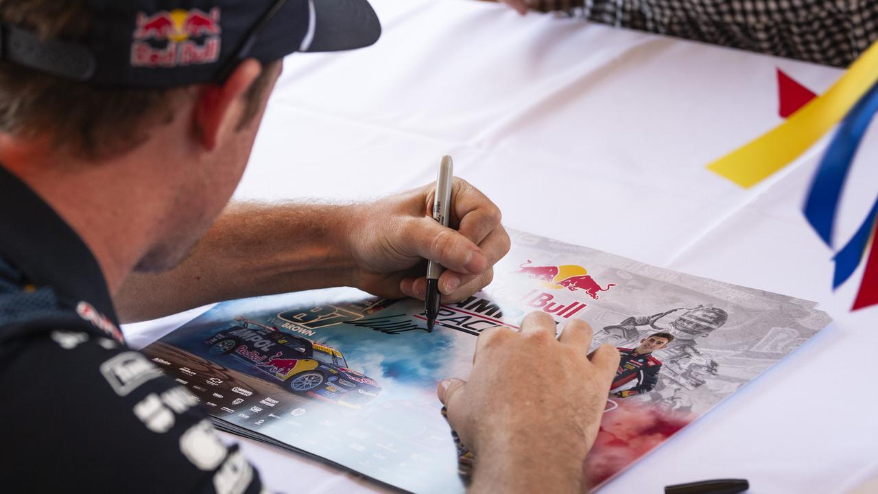 Supercar champion Will Brown signing autographs at Cars Galore in Toowoomba, Sunday, November 24, 2024. Picture: Kevin Farmer