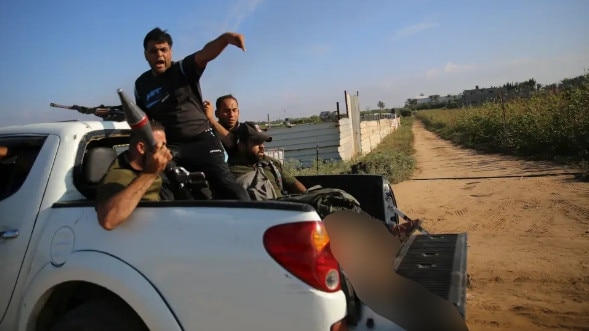 Shani Louk’s body being paraded on the back of a truck by Palestinian terrorists.