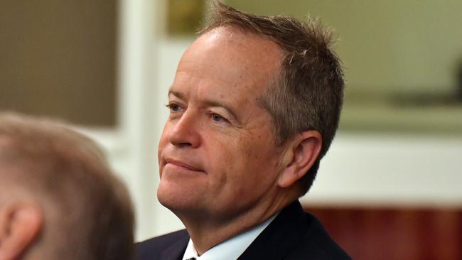 Former leader of the opposition Bill Shorten listens to Anthony Albanese at the Labor caucus meeting.