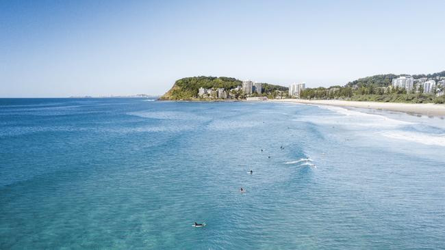 Aerial of surfers looking south from North Burleigh Heads to Burleigh Heads at the Gold Coast. Picture: TEQ