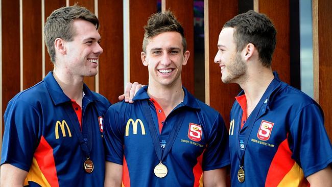  James Aish, right, with  Matthew Scharenberg and skipper Luke Dunstan, after SA's Under-18 National Championship win. Scharenberg and Aish are expected to be the first South Australians called at the NAB National Draft. 