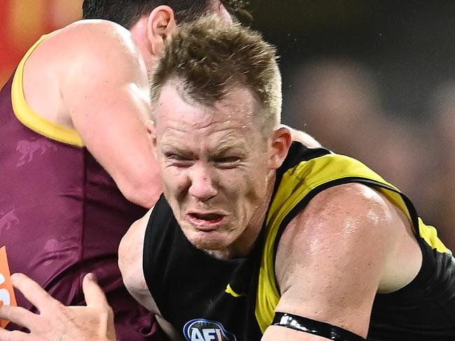 BRISBANE, AUSTRALIA - OCTOBER 02: Lachie Neale of the Lions is tackled Jack Riewoldt of the Tigers during the AFL Second Qualifying Final match between the Brisbane Lions and the Richmond Tigers at The Gabba on October 02, 2020 in Brisbane, Australia. (Photo by Quinn Rooney/Getty Images)