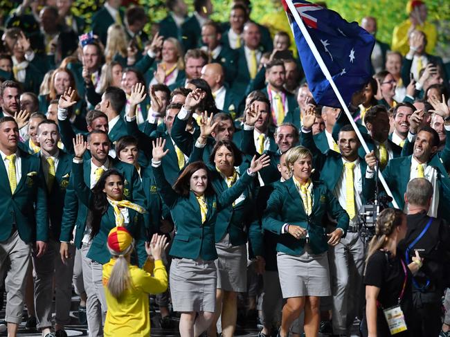 The Australian team are seen marching into the stadium during the Opening Ceremony of the XXI Commonwealth Games at Carrara Stadium on the Gold Coast, Australia, Wednesday, April 4, 2018. (AAP Image/Darren England) NO ARCHIVING, EDITORIAL USE ONLY