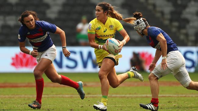 Charlotte Caslick bursts through for Australia against France. Picture: Brett Costello