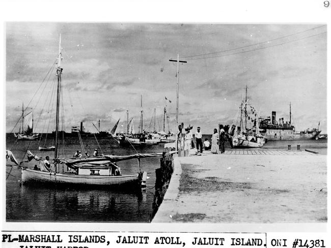 A US National Archives photo delivered to intelligence agency ONI shortly before WWII purportedly shows Amelia Earhart and her co-pilot, with the wreckage of her aircraft, captured by the Japanese.