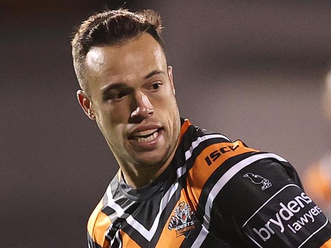 SYDNEY, AUSTRALIA - JULY 17: Luke Brooks of the Wests Tigers breaks through the defense during the round 10 NRL match between the Wests Tigers and the Brisbane Broncos at Leichhardt Oval on July 17, 2020 in Sydney, Australia. (Photo by Cameron Spencer/Getty Images)