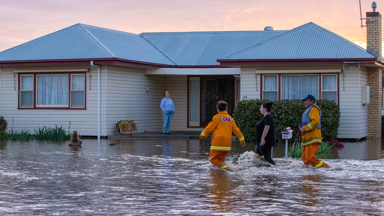 CFA volunteers walk door to door, checking homes in Rochester. Picture: Jason Edwards