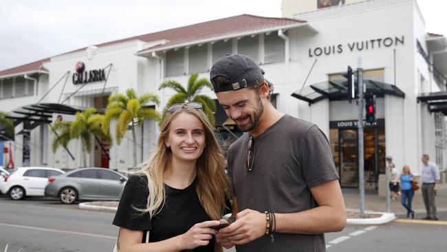 English tourists Jess Russell and Carl Hanrahan in front of the Galleria shop on the corner of Abbott St and Shield St which is going to be redeveloped. PICTURE: ANNA ROGERS