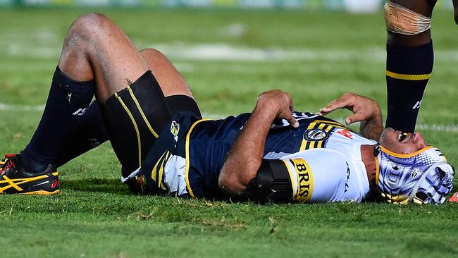 Johnathan Thurston of the Cowboys lies on the ground after being injured against the Knights.