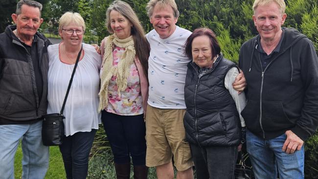 Shane-David Roberts-Wright with his 'bonus siblings' Veronica Davidson, Alicia Nicholls, Ron McConnell, Trevor McConnell at Faulkner Memorial Gardens where their brother Michael McConnell rests.