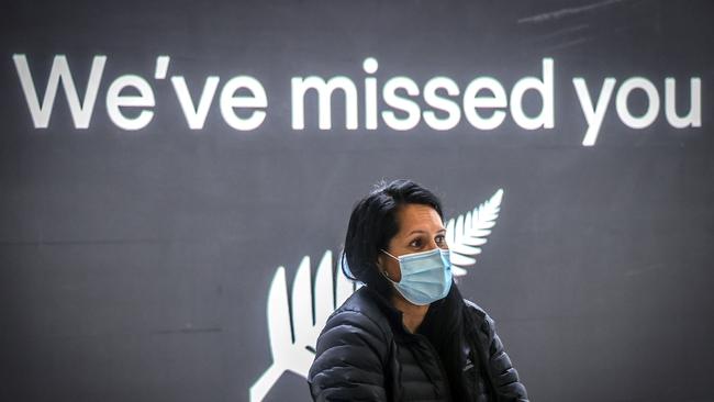 A passenger from New Zealand arrives at Sydney International Airport last week.