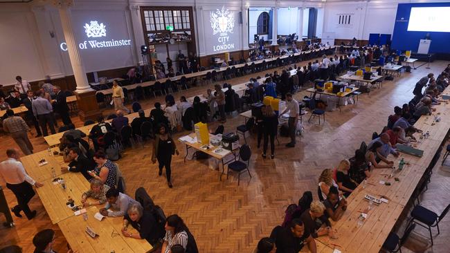 Vote counting staff await ballot papers at The Royal Horticultural Halls in central London.