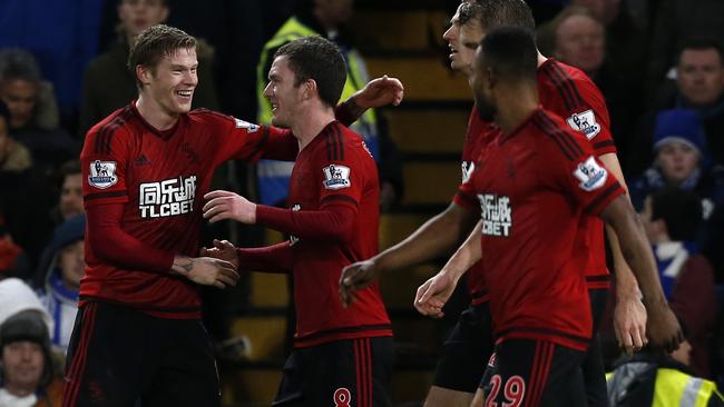 West Brom‘s James McClean (L) celebrates with teammates after scoring their second goal.