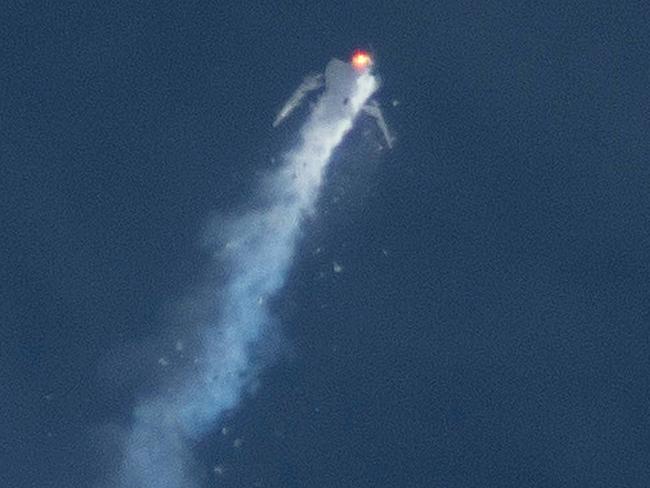 Moment of the disaster ... The Virgin Galactic SpaceShipTwo rocket explodes. Picture: AP Photo/Kenneth Brown