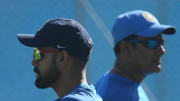 India's captain Virat Kohli (L) walks past coach Anil Kumble during the Indian team's training session at the Maharashtra Cricket Association Stadium in Pune on February 22, 2017. India will play a four match Test series against touring Australia with the first Test scheduled to start in Pune from February 23. ----IMAGE RESTRICTED TO EDITORIAL USE - STRICTLY NO COMMERCIAL USE----- / AFP PHOTO / INDRANIL MUKHERJEE / ----IMAGE RESTRICTED TO EDITORIAL USE - STRICTLY NO COMMERCIAL USE----- / GETTYOUT