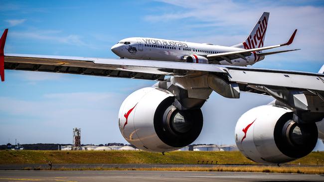 Qantas and Virgin Australia planes at Kingsford Smith International airport on November 15, 2019 in Sydney, Australia.