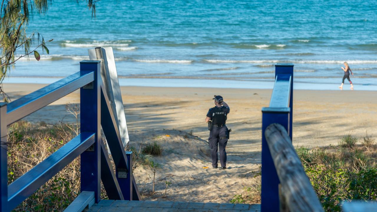 Police at Blacks Beach after a hairdresser was stabbed by sunbathing alone. Photo: Daryl Wright