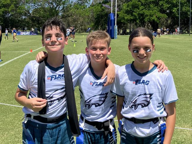 Howrah Primary School students Tex Daly, Cooper Wells and Macy Fitz at the 2024 U12 flag football national championships on the Gold Coast. Picture: Mitch Bourke.