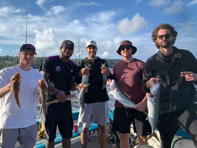 Sydney Kings players Shaun Bruce, Jarell Martin, Xavier Cooks, Tom Vodanovich and Jordan Hunter fishing in Sydney Harbour.