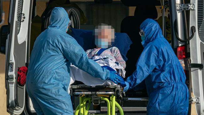 A resident is being removed from St Basil’s Greek Orthodoxdue to an outbreak. Picture: Jason Edwards