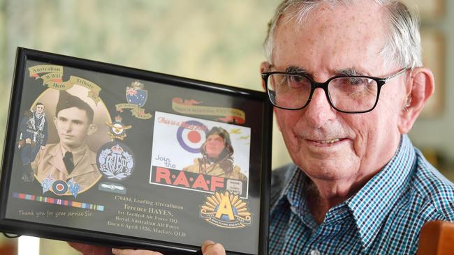 Veteran Terry Hayes holds a photograph of when he served in World War 11. Picture: Tony Martin