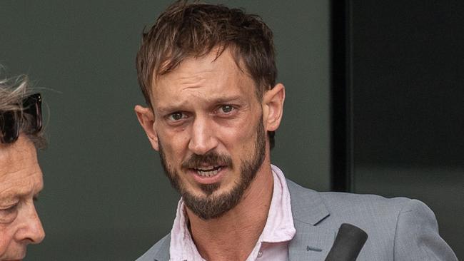 Cameron Micheal Petrie (grey suit) leaving Maroochydore Magistrates Court on Monday. Picture: Patrick Woods