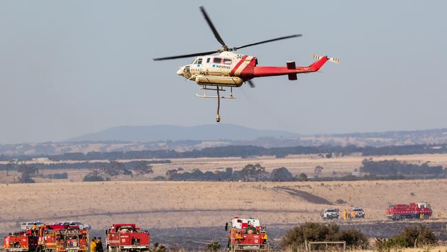 Firefighters try to stop a grass fire at Sunbury on New Year's Day, 2020. Picture: Dave Soderstrom Aviation Spotters Online