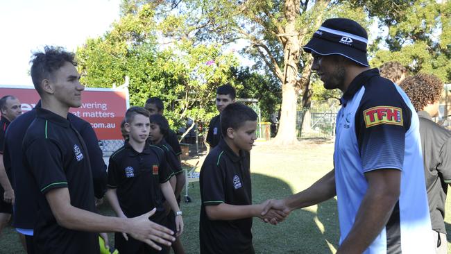 Cronulla Sharks players Shaun Johnson, Wade Graham and Will Chambers visit Orara High School. Sharks major sponsor Aramex made a $5000 donation to the Clontarf Foundation which operates at the school.