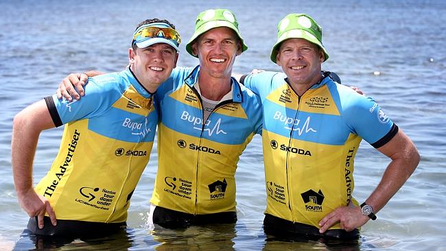 Ciaran Carroll, of Dublin, Ireland, Tom Carson and Neil Whillans, both of Brisbane, cool the legs off. Picture: Mike Burton. 