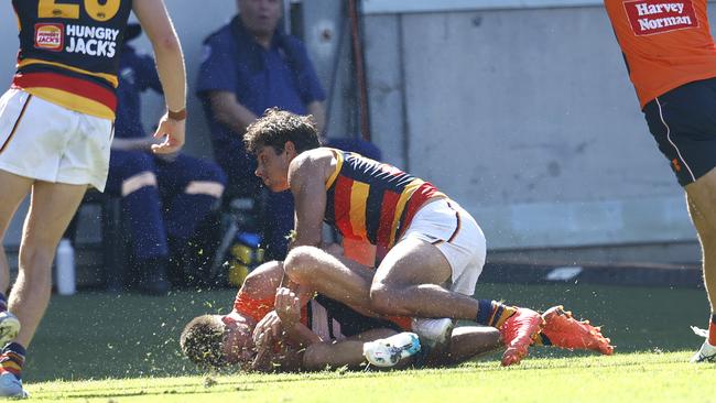 Adelaide's Shane McAdam late hit on Giants Jacob Wehr during the Round 1 AFL match between the GWS Giants and the Adelaide Crows at Giants Stadium on March 19, 2023. Photo by Phil Hillyard.