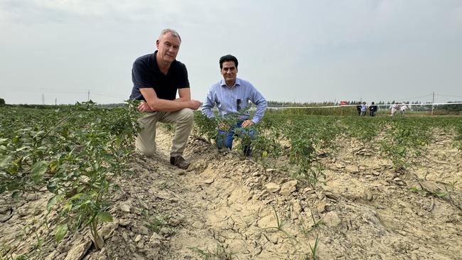 ANZ Head of Agribusiness Mark Bennett and Om Tyagi from Indian agricultural technology company UGL on the outskirts of Agra, India. Picture: Charlie Peel