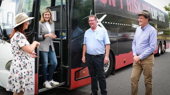 Labor’s ‘Cuts Bus’ from the 2020 state election, featuring Keppel MP Brittany Lauga, left, Minister Shannon Fentiman, Rockhampton MP Barry O’Rourke and Minister Anthony Lynham.