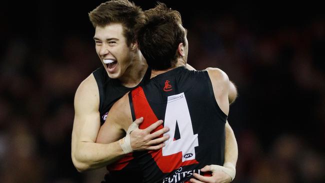 Zach Merrett celebrates a goal with Jobe Watson in Round 23.