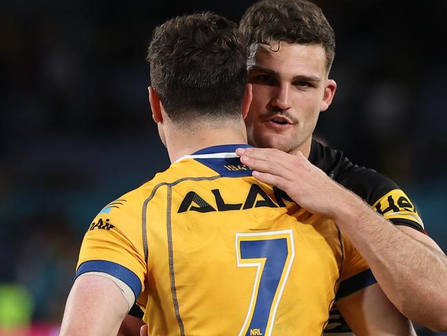 SYDNEY, AUSTRALIA - OCTOBER 02: Nathan Cleary of the Panthers and Mitchell Moses of the Eels embrace after the 2022 NRL Grand Final match between the Penrith Panthers and the Parramatta Eels at Accor Stadium on October 02, 2022, in Sydney, Australia. (Photo by Cameron Spencer/Getty Images)