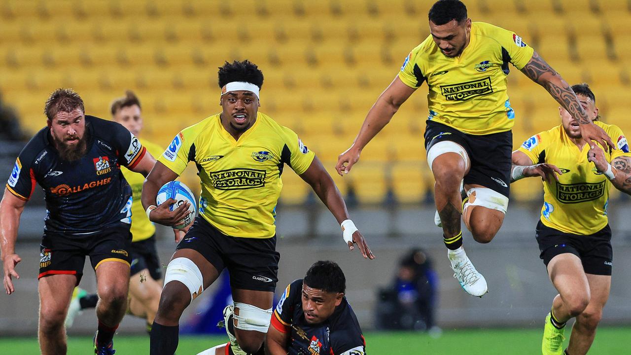 The Hurricanes and Chiefs play their Super Rugby match in front of a host of empty yellow seats. Picture: Grant Down/AFP