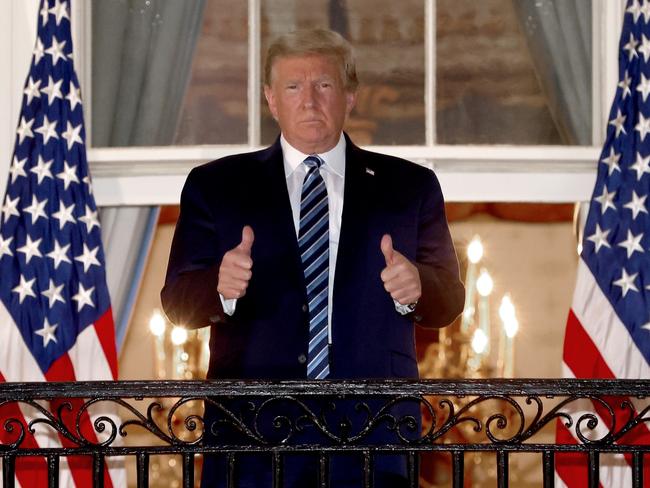 Donald Trump gives a thumbs up upon return to the White House from Walter Reed National Military Medical Center. Picture: Getty