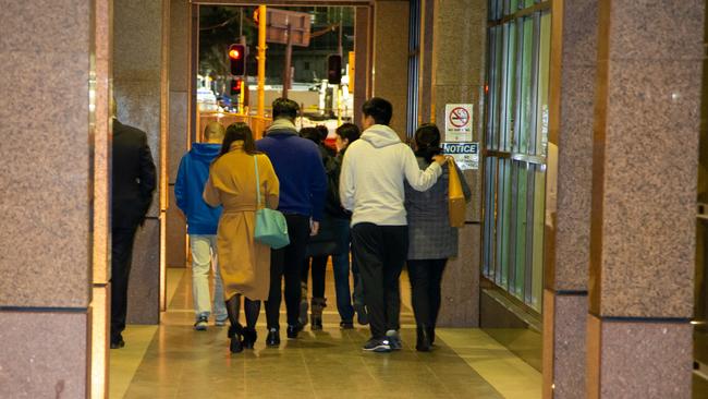 People leaving Mascot Towers meeting at the Stamford Mascot in August.