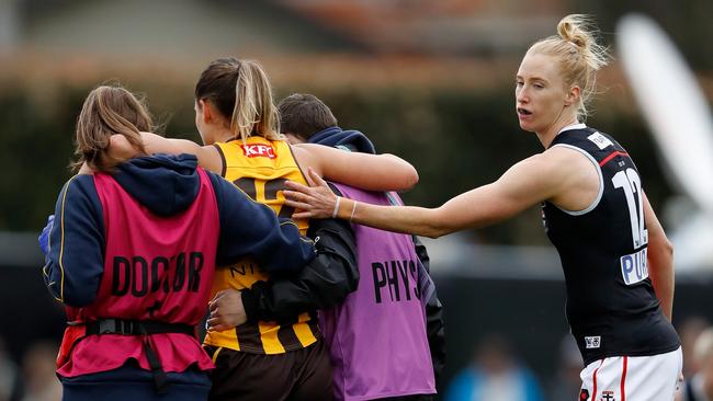 St Kilda’s Kate Shierlaw consoles Hawk Louise Stephenson as she leaves the ground with a fractured left ankle. Picture: Getty Images