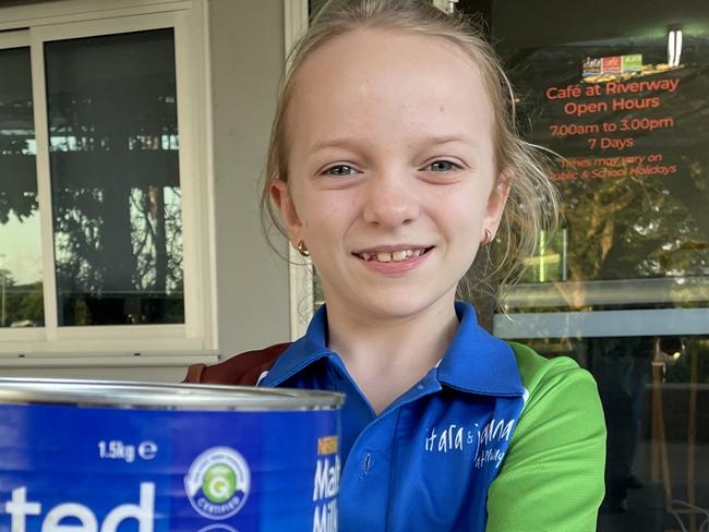 Cafe at Riverway helper Brienna Steele, 11, with the malted milk her parents use to make the cafe's 'old school' vanilla malt milkshakes.