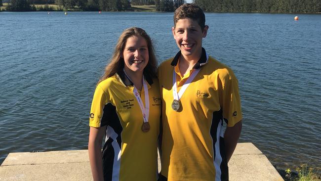 Madeline Franjic and Matthew Galea from the Blacktown City Swimming Club with their medals from the state open water competition.