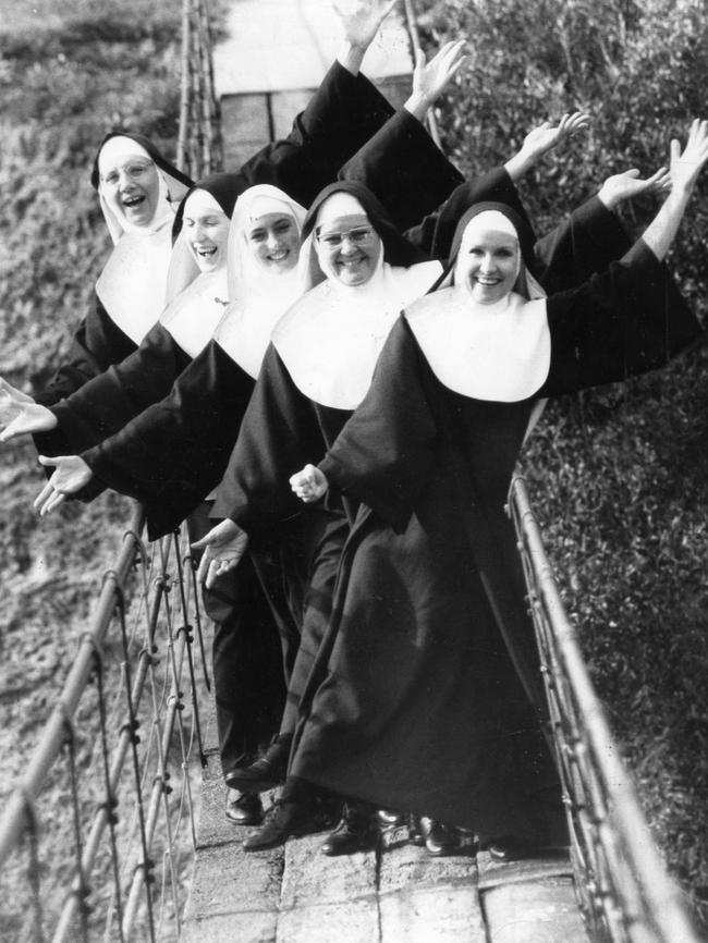 The ‘Swinging Nuns’ from theatre production <i>Nunsense</i>, on the Gilberton swing bridge, July 1987.