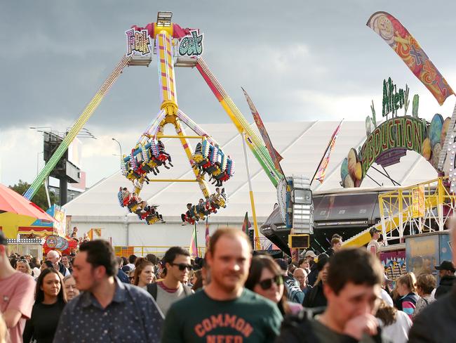 A crowd is seen at Sideshow alley during the Brisbane Royal Exhibition show, locally known as the Ekka, in Brisbane, Wednesday, August 14, 2019. (AAP Image/Jono Searle) NO ARCHIVING