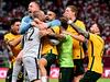 DOHA, QATAR - JUNE 13: Australia celebrate after defeating Peru in the 2022 FIFA World Cup Playoff match between Australia Socceroos and Peru at Ahmad Bin Ali Stadium on June 13, 2022 in Doha, Qatar. (Photo by Joe Allison/Getty Images)