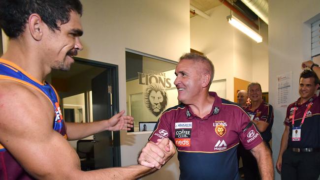 Brisbane’s Charlie Cameron (left) celebrates with Lions coach Chris Fagan beating the West Coast Eagles in the AFL’s opening round. Picture: Darren England