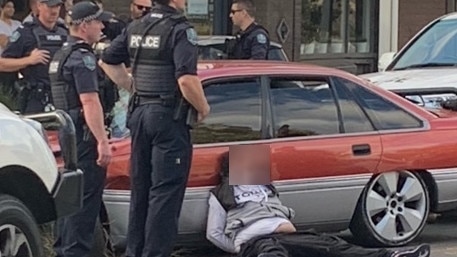 Police are seen arresting a man at Brompton on Sunday, May 1, 2022. Picture: Nick Blain