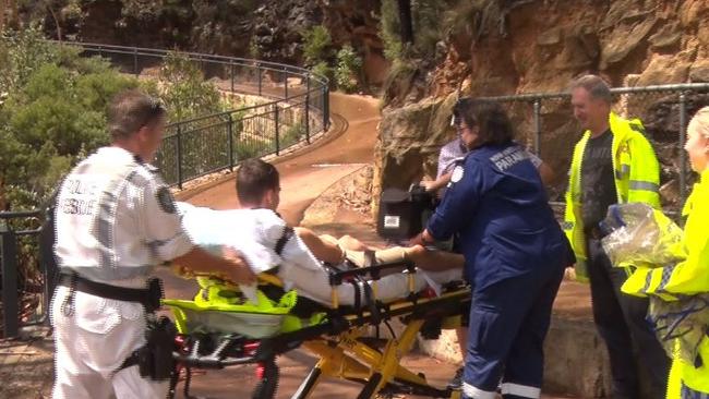 Paramedics treat a teen boy after he was struck by lightning in Katoomba. Picture: TNV