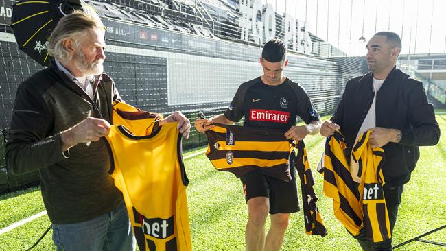 Tuck and Shaun Burgoyne (right) had Scott Pendlebury sign their Hawthorn jumpers at a special presentation at the Collingwood Football Club. Picture: Daniel Pockett / Getty Images